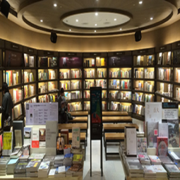 A room filled with lots of books and magazines.