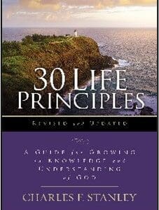 A book cover with the title of 3 0 life principles.