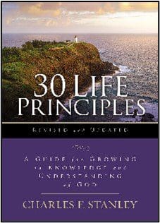 A book cover with the title of 3 0 life principles.