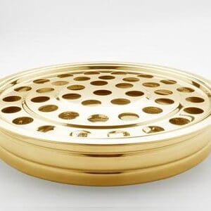 A gold plate with holes in it