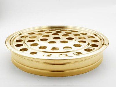 A gold plate with holes in it