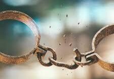 A pair of handcuffs hanging on the side of a window.